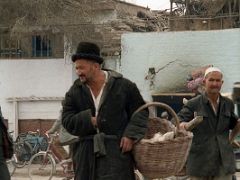16 Kashgar Old City Street Scene 1993 Man Carrying Basket.jpg